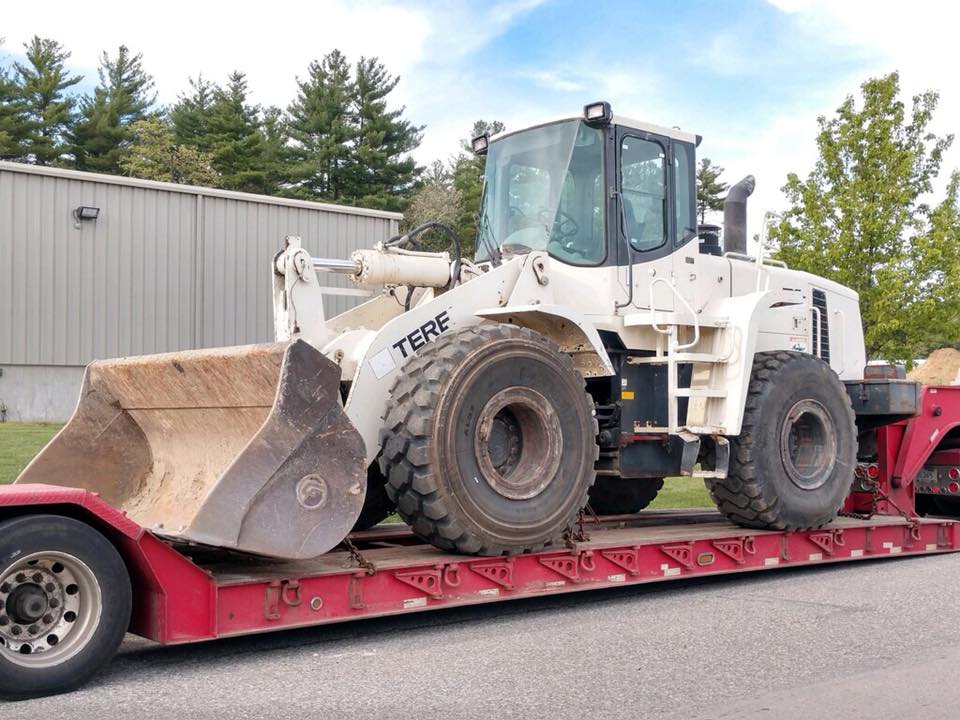 Front end loader loaded on the Iron Haulers trailer