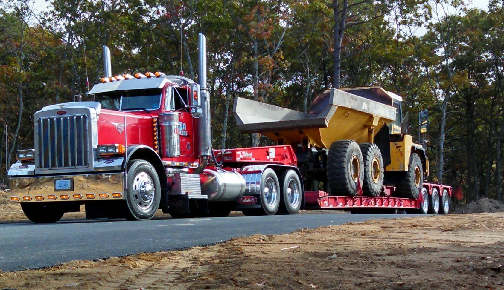 Iron Haulers truck moving a rock truck